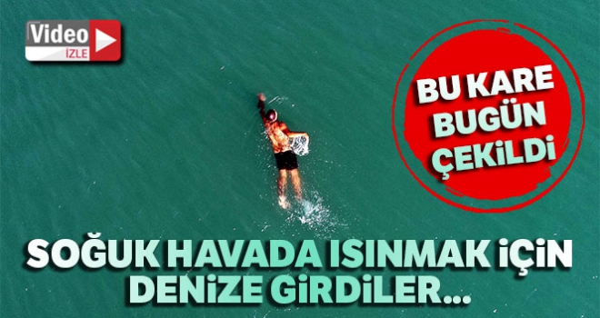 Kar soğuğunun vurduğu Antalya'da vatandaşlar ısınmak için denize girdi