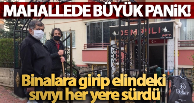 Binalara girip elindeki sıvıyı her yere süren kadın panik oluşturdu