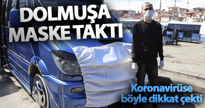 Korona virüse dikkat çekmek için dolmuşuna maske taktı